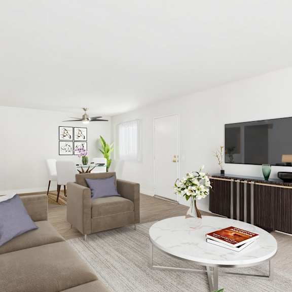 a living room with a couch, chairs, and a television.