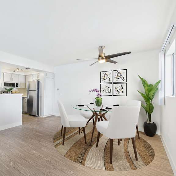 a dining room with a table and chairs.