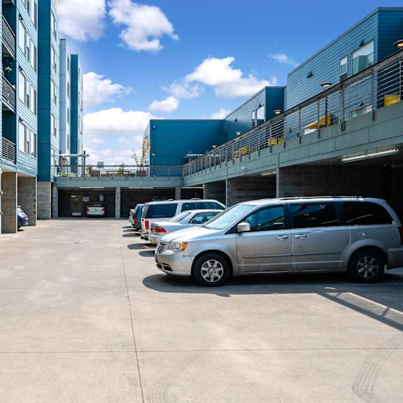 a row of parked cars in front of a building