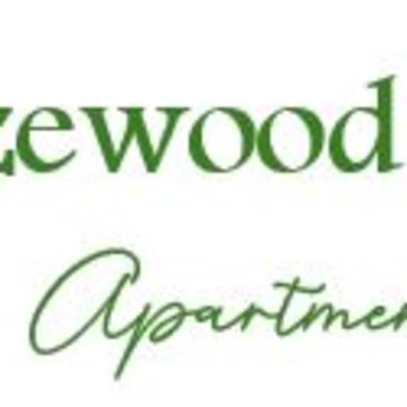 a logo for breezewood village apartments.