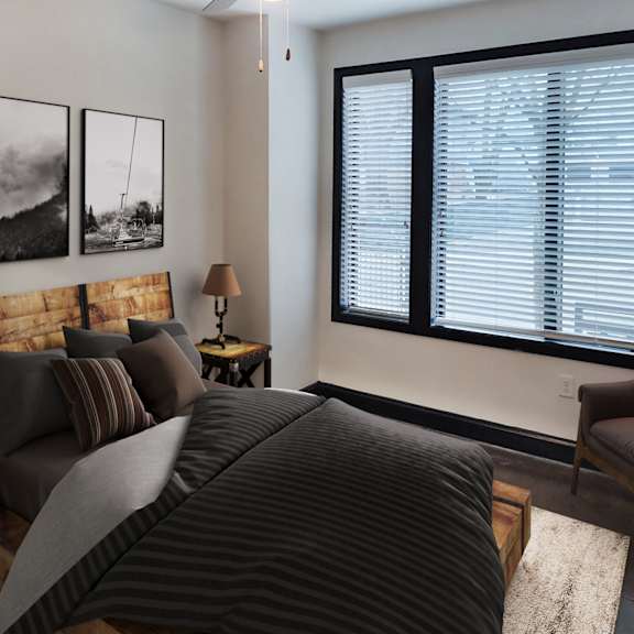 Thumbnail 6 of 7 A bedroom with a large bed and two lamps.