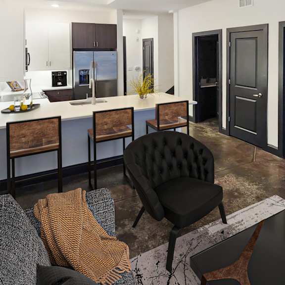 Thumbnail 3 of 7 A modern living room with a black chair and a grey couch.