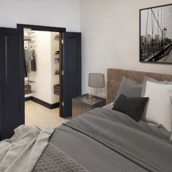 Thumbnail 7 of 7 A bedroom with a large bed and a bridge picture on the wall.