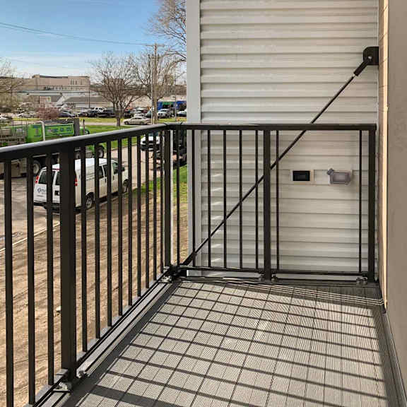 Thumbnail 28 of 36 a balcony with a black iron railing