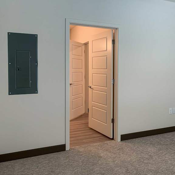 Thumbnail 12 of 15 a bedroom with an attached bathroom
