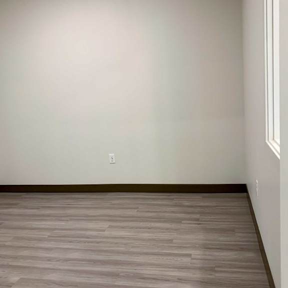 Thumbnail 7 of 15 a den with hardwood floors