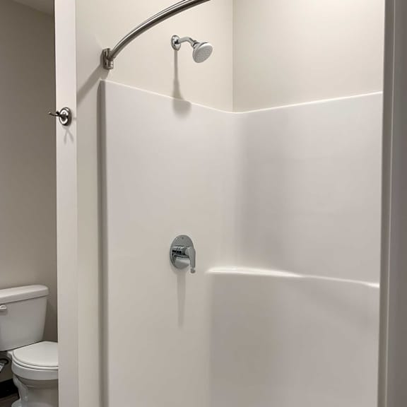 Thumbnail 12 of 13 a bathroom with a walk in shower