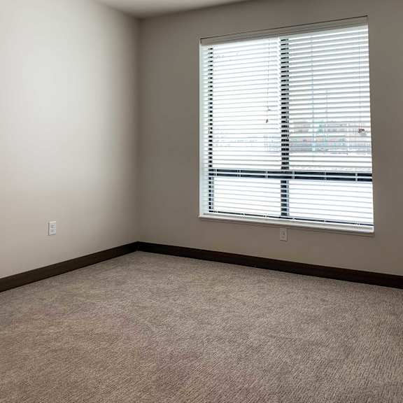 Thumbnail 8 of 13 a bedroom with a large window