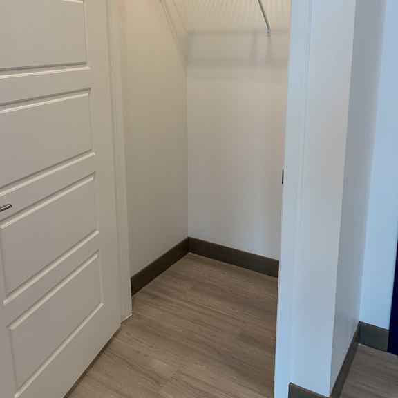 Thumbnail 3 of 13 a coat closet with shelving