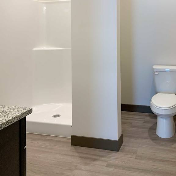Thumbnail 16 of 36 a bathroom with walk in shower