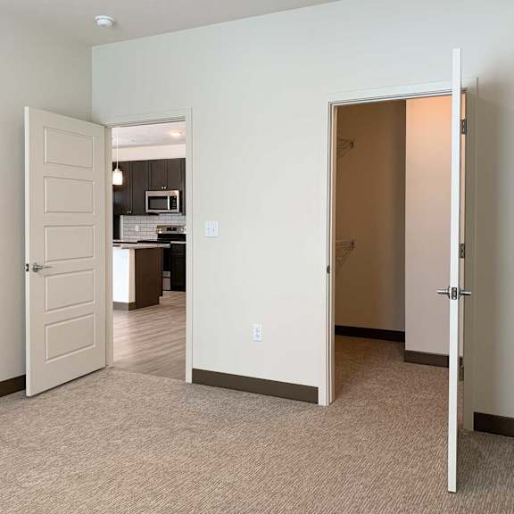 Thumbnail 11 of 36 a bedroom with a large walk in closet