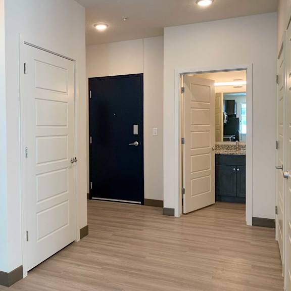 Thumbnail 2 of 36 an entry way with a large coat closet and hall bathroom