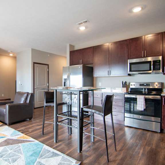 Thumbnail 8 of 19 Open layout with dining and living room in a one bedroom with denat 360 at Jordan West best new apartments West Des Moines IA 50266