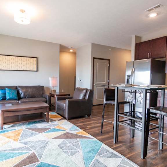 Thumbnail 7 of 19 Living room and kitchen space at 360 at Jordan West