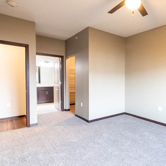 Thumbnail 16 of 18 Bedroom with attached bathroom and ceiling fan at 360 at Jordan West