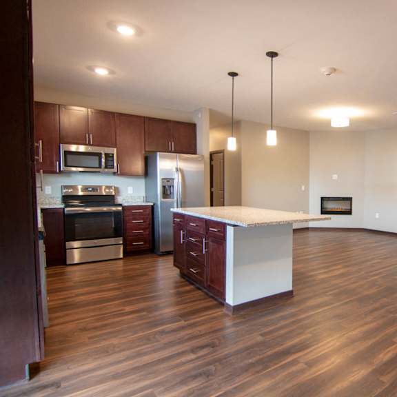 Thumbnail 4 of 18 Large open floor plan living room and kitchen space at 360 at Jordan West