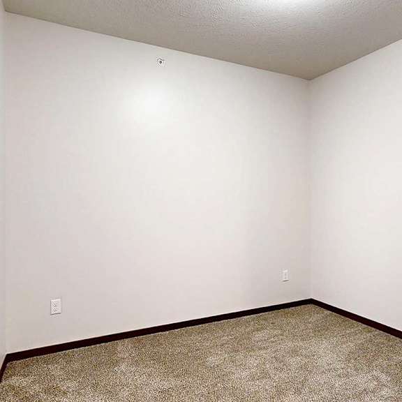 Thumbnail 26 of 29 A den space with a carpeted floor and a multiple outlets, perfect for an at home office.