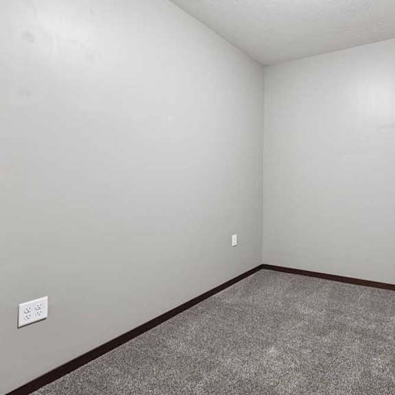 Thumbnail 34 of 34 A carpeted den space with several outlets.