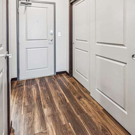Thumbnail 3 of 15 An entry hallway with a sliding door closet.