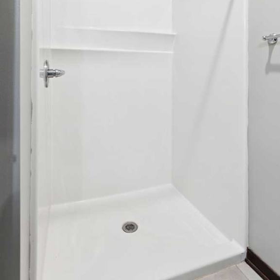 Thumbnail 11 of 11 A bathroom with a walk-in shower.