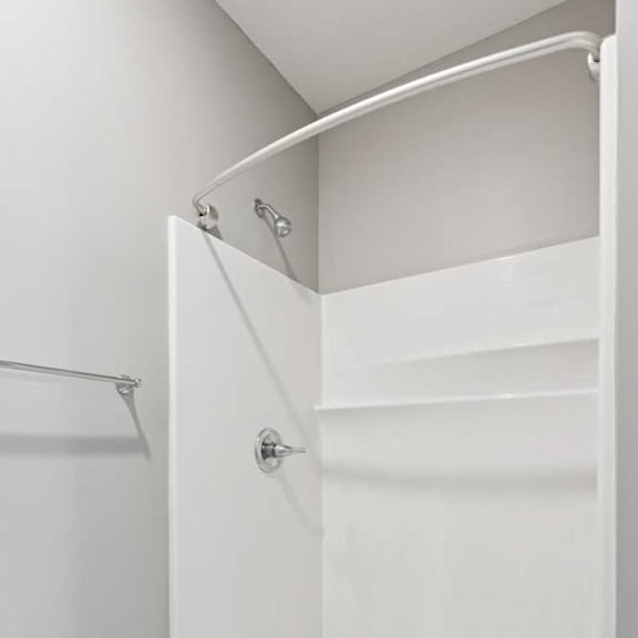 Thumbnail 15 of 19 A bathroom with a walk-in shower.