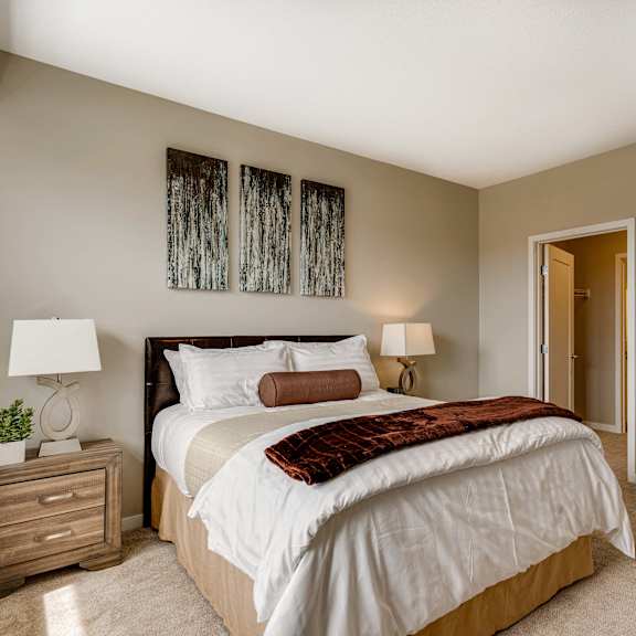 Thumbnail 12 of 19 Large bedroom with attached bathroom and walk in closet in 2 bedroom apartment for rent at Ascend at Woodbury best apartments Woodbury MN 55129