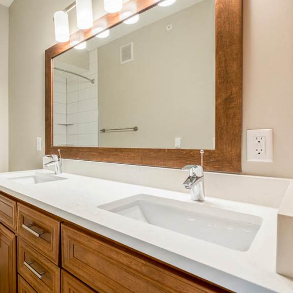 Thumbnail 12 of 12 Dual sinks in bathroom with tiled tub in premium unit at Ascend at Woodbury new luxury apartments in Woodbury MN 55129