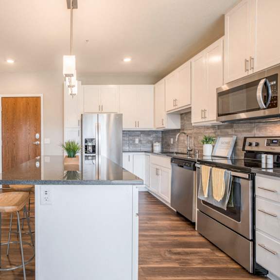 Thumbnail 9 of 12 Alpine design scheme kitchen with white cabinets at Ascend at Woodbury new luxury apartments in Woodbury MN 55129