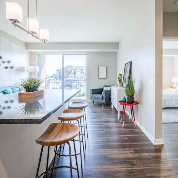 Thumbnail 2 of 12 Open layout with view of living room from kitchen at Ascend at Woodbury new luxury apartments in Woodbury MN 55129