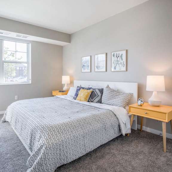 Thumbnail 11 of 12 Bedroom with large windows at Ascend at Woodbury new luxury apartments in Woodbury MN 55129