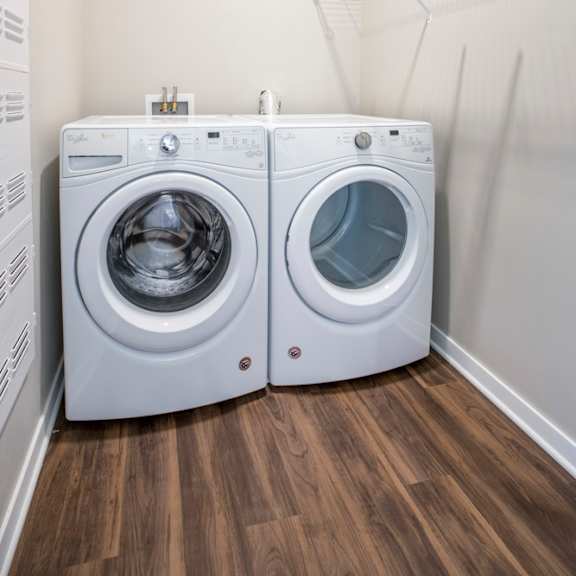 Thumbnail 12 of 12 Front loading washer and dryer in a laundry room