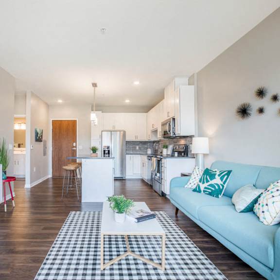 Thumbnail 7 of 12 Open floor plan with hardwood floors and white cabinetry at Ascend at Woodbury MN 55129 new luxury apartments