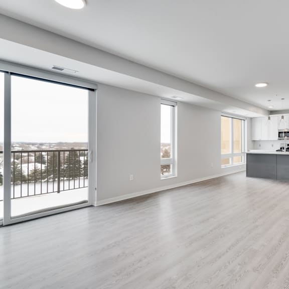 Thumbnail 7 of 16 Open living and dining area with lots of natural light at Aspire at CityPlace in Woodbury, Minnesota