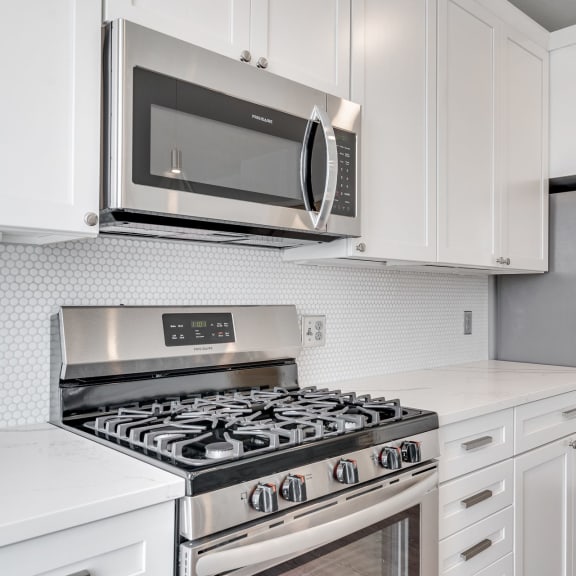 Thumbnail 4 of 16 Matching stainless steel appliances in the kitchen of a luxury apartment home at Aspire at CityPlace in Woodbury, Minnesota