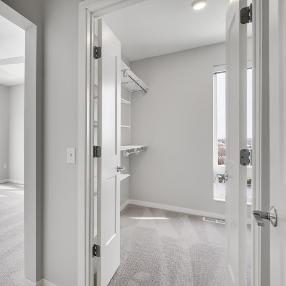 Thumbnail 11 of 16 Master bedroom and large master closet with a lot of storage space at Aspire at CityPlace in Woodbury, Minnesota