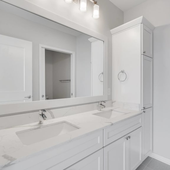 Thumbnail 16 of 16 Large dual sink vanity in luxury bathroom at Aspire at CityPlace in Woodbury, Minnesota