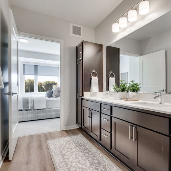 Thumbnail 13 of 13 Spacious bathroom with dual vanities and lots of storage in luxury apartment in Woodbury MN 55125