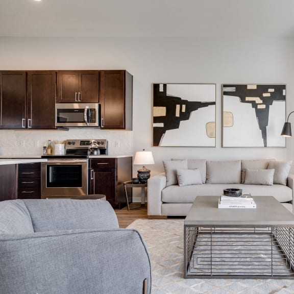 Thumbnail 8 of 13 Living space with warm brown floors in luxury apartment Woodbury MN 55125