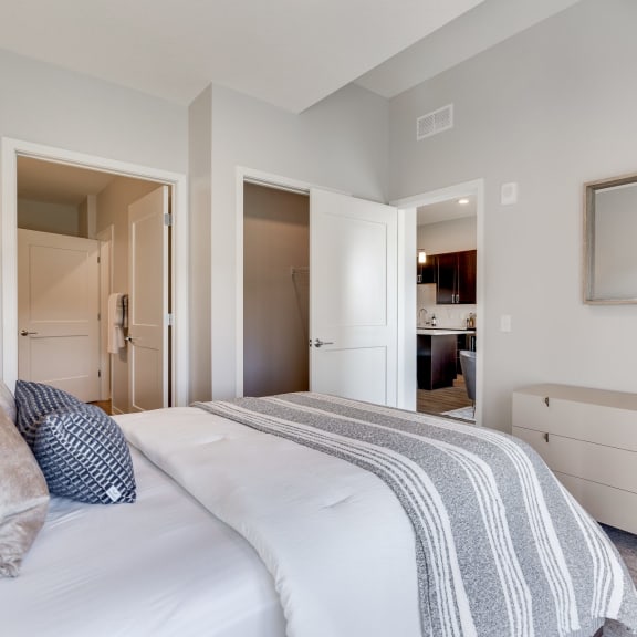Thumbnail 10 of 13 Large bedroom with connected bathroom and walk in closet in luxury apartment In Woodbury MN 55125