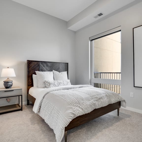 Thumbnail 8 of 15 Bedroom with high ceiling and large window in two bedroom luxury apartment Woodbury MN 55125