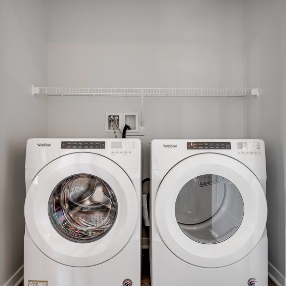 Thumbnail 10 of 15 Side by side front loader washer and dryer in a laundry closet in two bedroom luxury apartment Woodbury MN 55125
