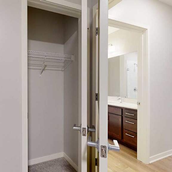 Thumbnail 12 of 19 A white door with a mirror on the other side.