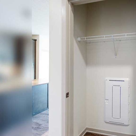 Thumbnail 24 of 30 a coat closet with a built-in shelf in the front entryway