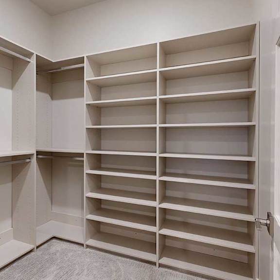 Thumbnail 38 of 46 An adjacent walk-in closet off the primary boutique-style closet.