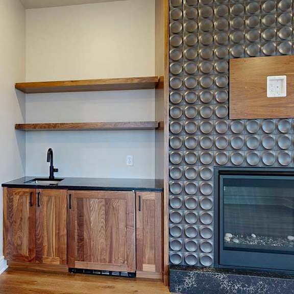 Thumbnail 28 of 46 A modern living room with a built-in wet bar.