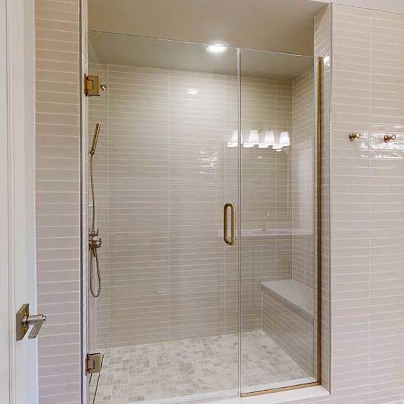 Thumbnail 24 of 31 Tiled walk-in shower with glass door and gold fhardware