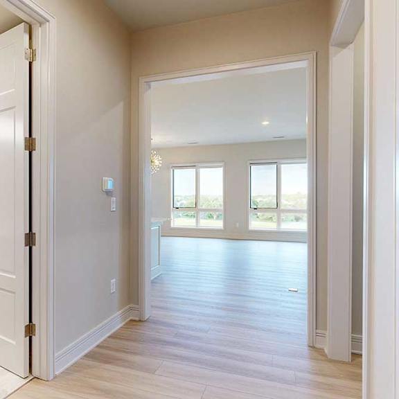 Thumbnail 2 of 31 Hallway looking towards the penthouse living room and hall bath to the left