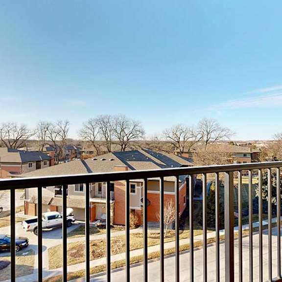 Thumbnail 13 of 30 a balcony with a metal railing and a view of the neighboring Villas at Wilderness Ridge