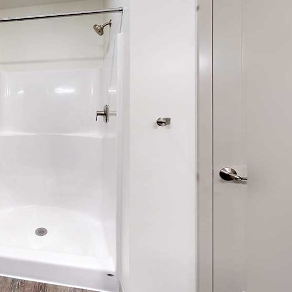 Thumbnail 21 of 30 a bathroom with a white walk-in shower