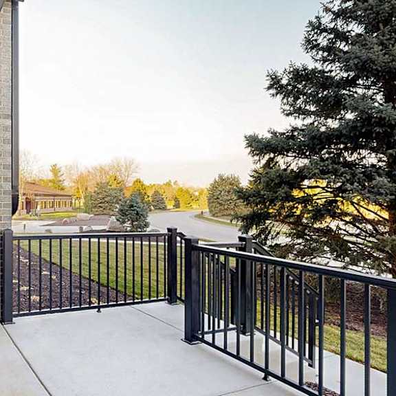 Thumbnail 14 of 26 a black windowed door on a walk-out patio